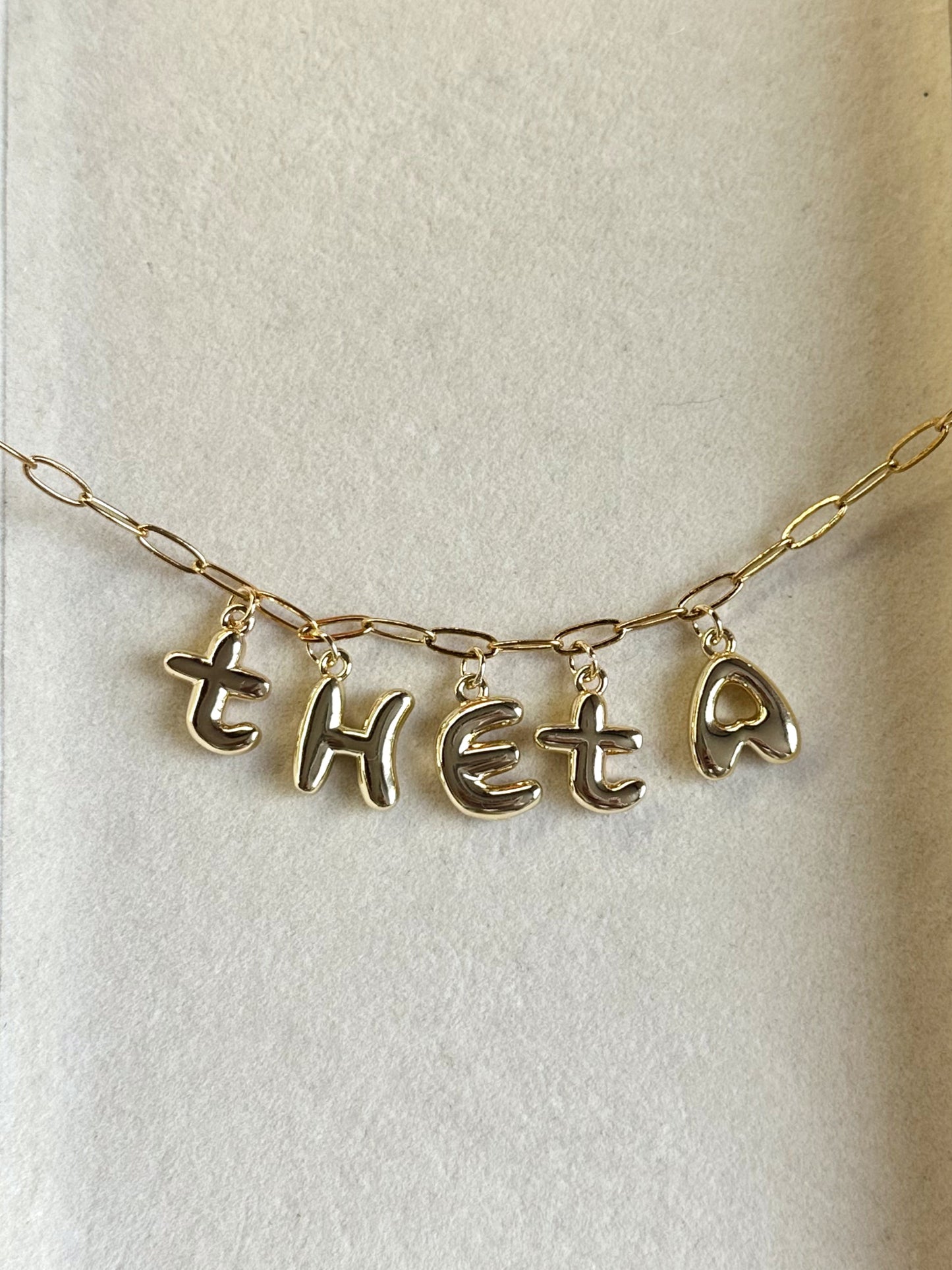 theta necklace